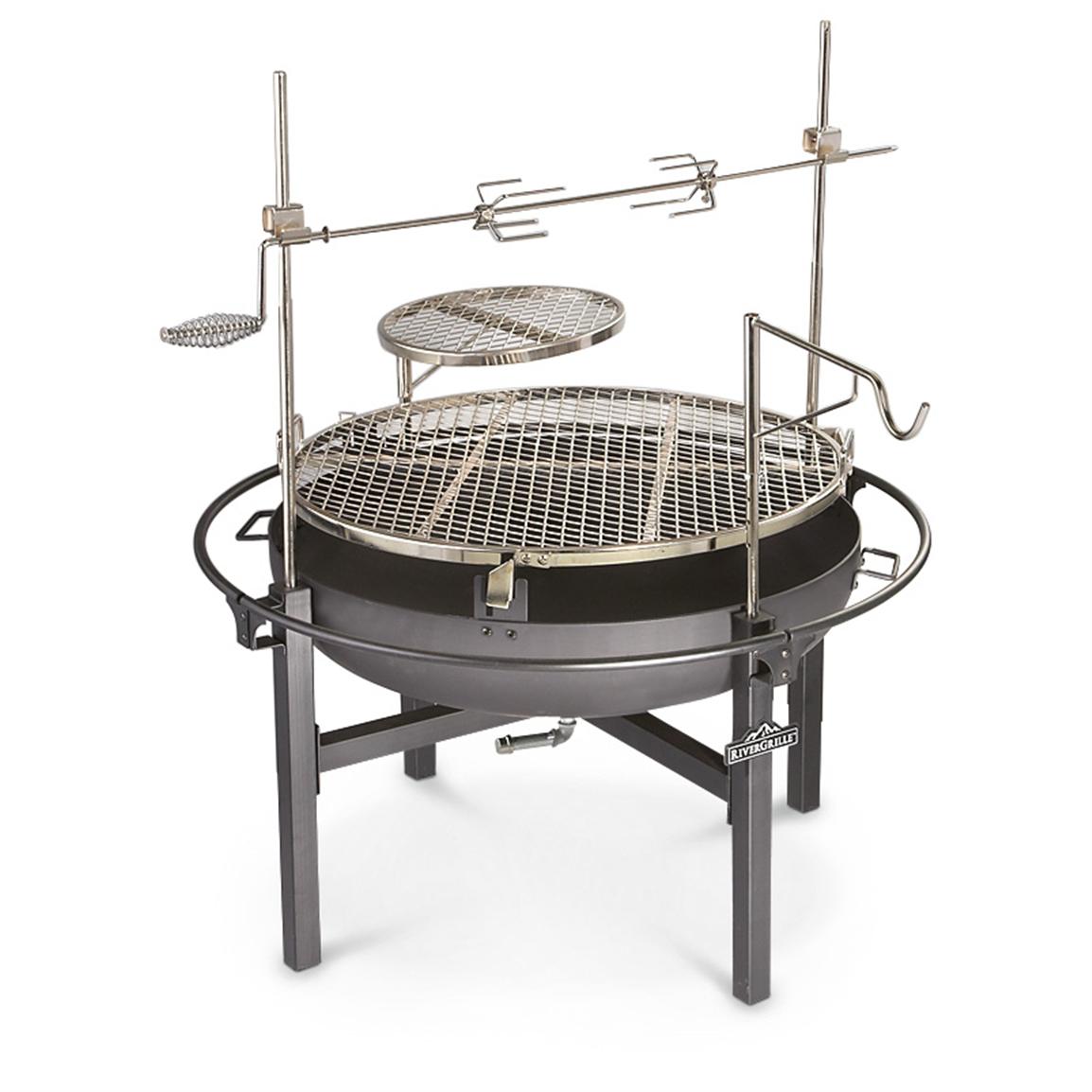 Man Cooking with Tripod Gas Cooker Cowboy Fire Pit Rotisserie Grill 282386 Stoves at 