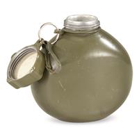 Threaded cap with keeper and metal clip