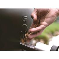 Side wood chip loader lets you add more wood without opening the door
